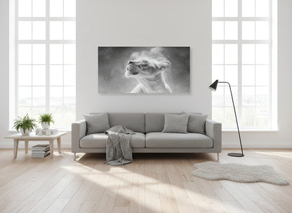Modern living room with a gray sofa, coffee table, and a  large fine art print on the wall of an etheral lioness, 