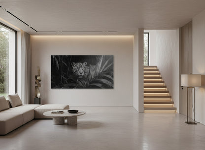 Modern living room with a large wall-mounted large fine art print of a jaguar, a staircase, and minimal decor.