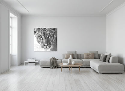 Modern living room with a large sofa and a fine art print of a lioness on the wall.